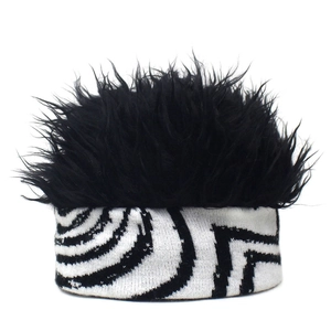 Detail of creative knit beanie with fluffy black faux fur wig top and geometric pattern band