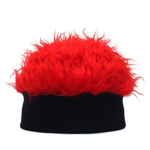 Detail of red fluffy wig hat with dense synthetic fur and black elastic band for parties
