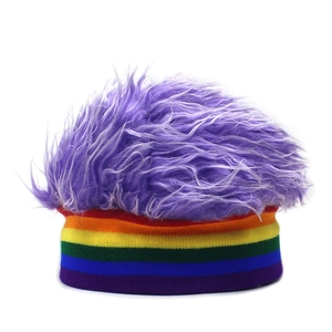 Detail of colorful rainbow striped knit hat featuring a funny purple faux fur wig top