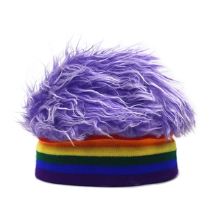 Detailed view of plush purple faux hair texture on a rainbow striped knitted party beanie