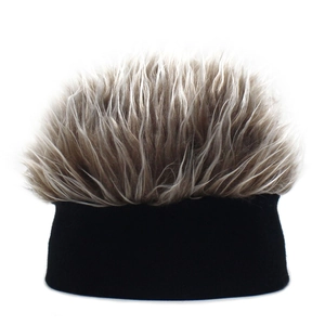 Detailed close-up of novelty knit beanie featuring fluffy faux hair in light brown and grey