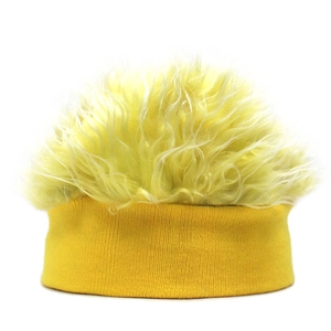 Close-up of funny yellow wig beanie with fluffy synthetic fiber and knitted cuff