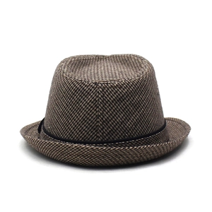 Detailed view of brown houndstooth trilby hat fabric with black ribbon trim