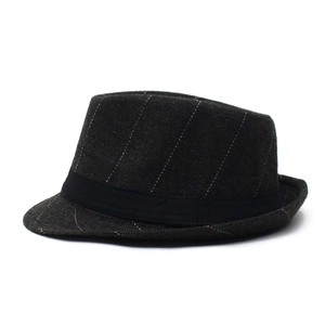 Detail shot of herringbone pattern tweed trilby hat with elegant black ribbon band