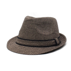 Classic houndstooth fedora hat with black band, shown in a stylish 45-degree angle view