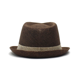 Close-up of brown linen fedora hat with breathable weave texture and light beige band