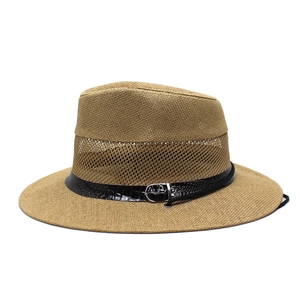 Detail view of khaki straw hat featuring breathable mesh design and black leather band