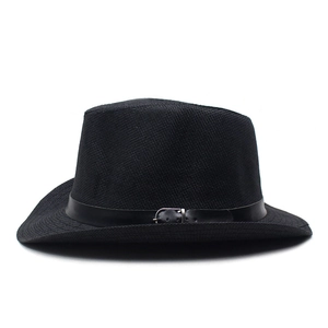 Detail of black woven straw fedora hat with elegant faux leather belt and metal buckle