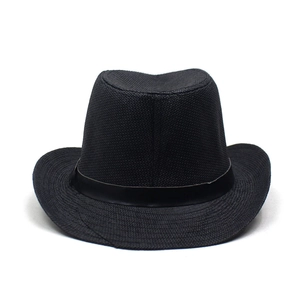 Detailed close-up of woven texture on a black straw fedora with satin band