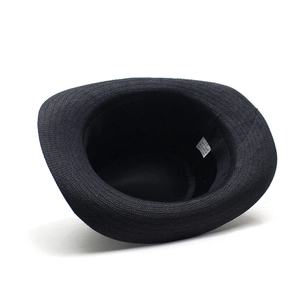 Detail view of internal 100% paper material label and size 58 mark on black straw hat