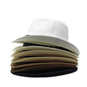 Vertical stack of woven straw fedora hats in various neutral shades with ribbon detail