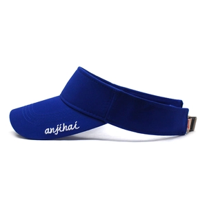 Detail view of adjustable strap and embroidery on navy blue sun visor sports cap