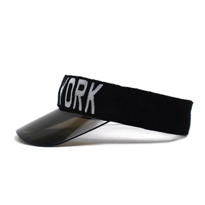 Detail of black New York knit sun visor featuring a gray transparent PVC brim