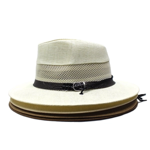 Detail of breathable mesh weave and faux leather band on men's summer straw sun hats
