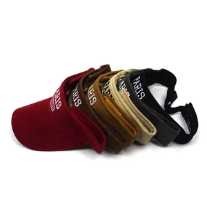 Detail view of colorful sun visor hats with white PARIS embroidery and canvas texture