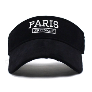 Detail of white Paris embroidery on black visor hat with premium matte texture