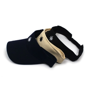 Three cotton sun visors in blue, beige, and black with leaf embroidery and adjustable straps
