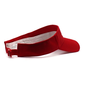 Detail of red cotton sun visor showing adjustable metal buckle and quality stitching