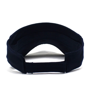 Detail of adjustable hook-and-loop strap on a navy blue cotton open top sun visor hat