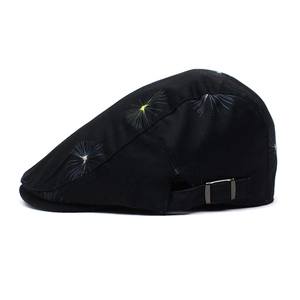 Black cotton beret cap with dandelion print and adjustable silver metal buckle detail