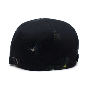 Detail of the silver metal adjustable buckle on the dandelion print cotton newsboy cap