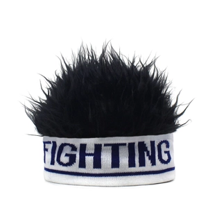 Close-up of fighting letter knitting band and black fluffy synthetic hair wig cap