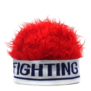 Close-up of red wig knit hat featuring bold blue FIGHTING letters on white elastic band