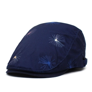 Navy blue cotton beret hat with white dandelion print and adjustable side buckle for adults
