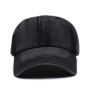Detailed front view of a vintage washed black denim baseball cap with curved brim and texture