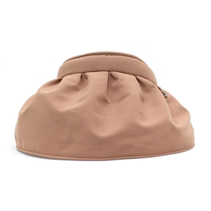 Detail of caramel wide-brim sun visor featuring decorative pleated fabric and wavy texture