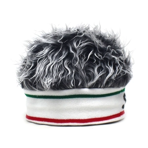 Detailed macro view of high-quality faux hair fibers on white knit beanie with striped trim