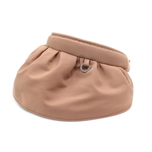 Detail of wide foldable sun hat brim with elegant metal D-ring buckle and pleated texture