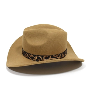 Detailed view of leopard print band and gold stud on a khaki felt western cowboy hat