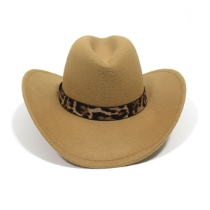 Close-up of camel western cowboy hat with leopard print band and curved brim detail