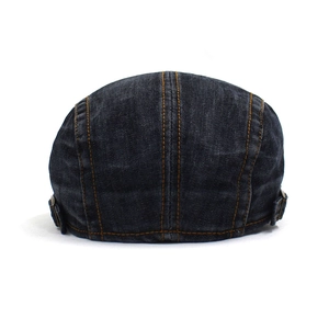 Washed denim ivy cap with contrast stitching and adjustable metal buckle