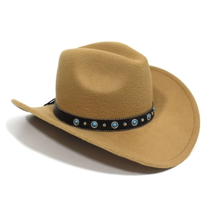 Detail of camel felt cowboy hat featuring turquoise beads and silver metal rivets on leather band