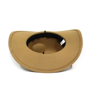 Inside view of a camel western cowboy fedora hat showing inner sweatband and texture