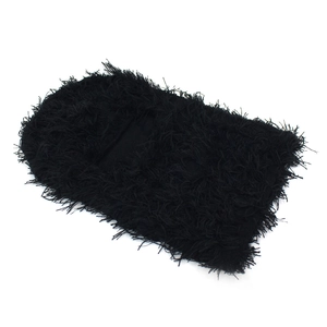 Detail of black long-hair knit balaclava showing fluffy texture and warm fleece material
