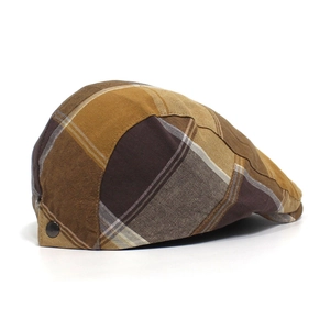 Close-up of retro plaid pattern flat cap with side metal buckle and multi-color stitching