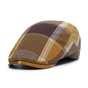 Detail shot of the vintage plaid pattern and premium cotton texture of the newsboy cap