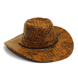 Close-up of orange western cowboy hat with crocodile skin texture and black decorative cord