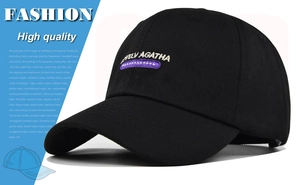 Detailed view of white LOVELY AGATHA embroidery on a black cotton baseball cap