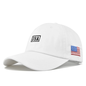 Close-up of USA embroidery and flag patch on a white cotton twill baseball cap