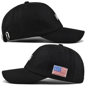 Detail view of cotton baseball cap featuring embroidered USA flag and metal buckle strap