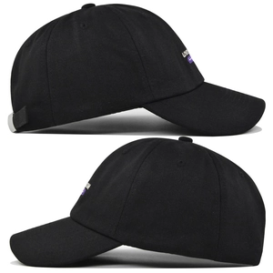 Detail of LOVE embroidery on black cotton baseball cap with adjustable strap and curved brim
