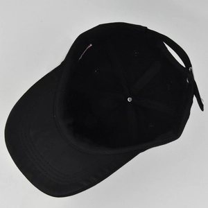 Detailed interior of black baseball cap showing sweatband and adjustable back strap