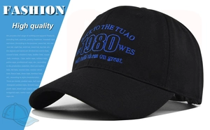 Close-up of vintage 1980 embroidery on black twill cotton baseball cap with retro lettering