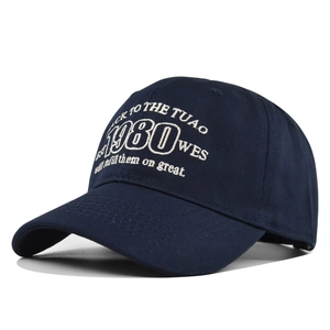 Navy blue cotton baseball cap with vintage 1980 embroidery and curved brim