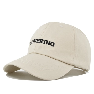 Detail of GATHERING embroidery on off-white cotton twill baseball cap with stitching
