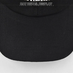 Detail view of the black baseball cap brim featuring precise stitching and twill fabric